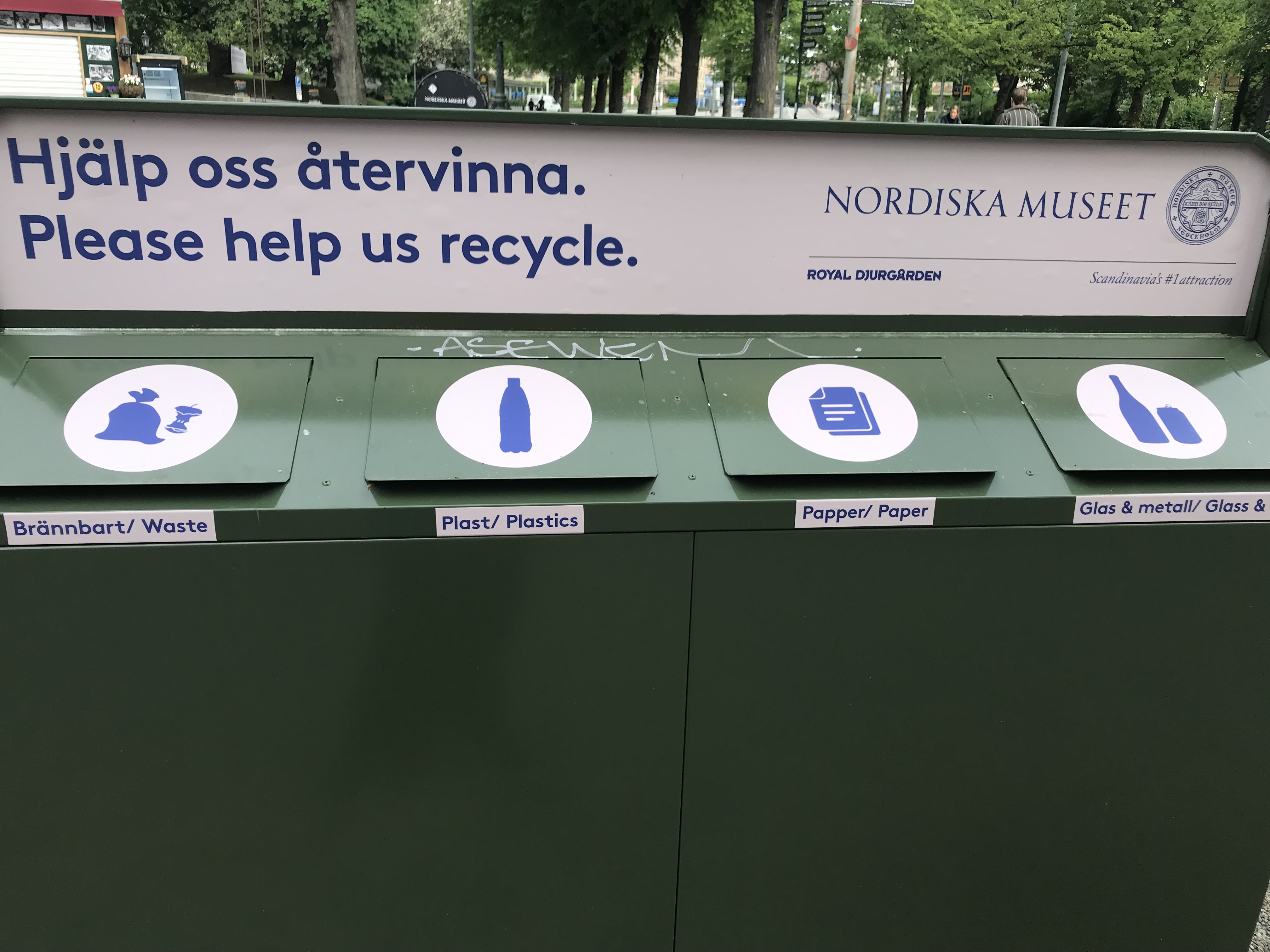 Segregated garbage bins (waste, plastics, paper, glass & metal) outside the Nordiska Museet (Nordic Museum) show how recycling can be a way of life 